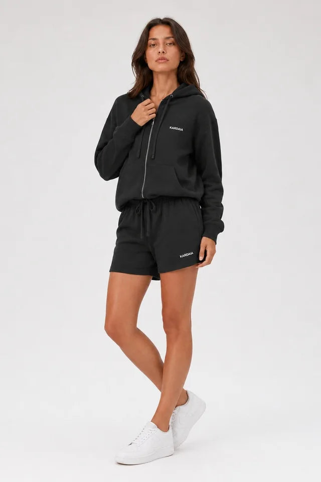 Sweat à capuche zippé femme noir en coton bio avec main au col